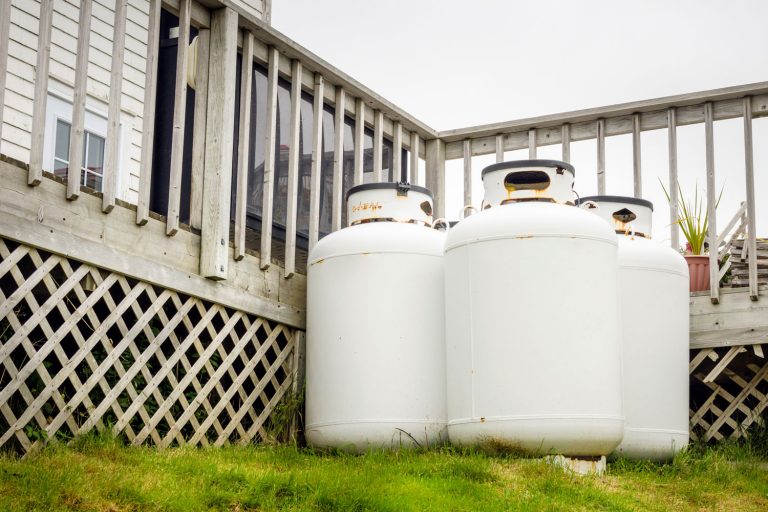Propane Cylinder tank in the backyard of a House, Patio Heater Propane Tank Freezing—What To Do?