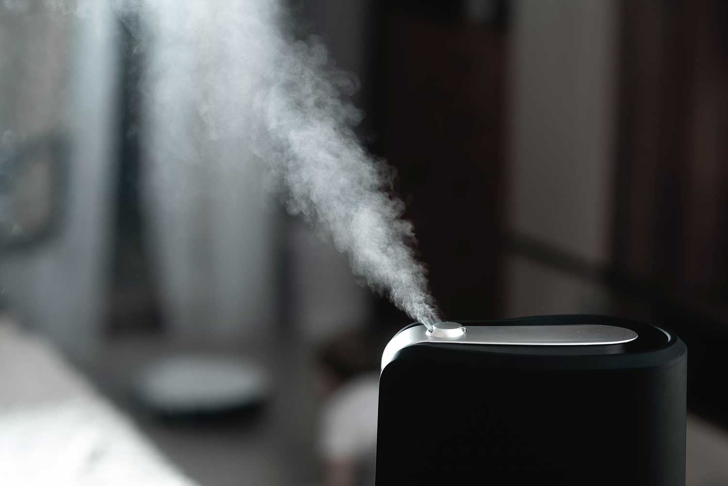 Steam coming out from the humidifier at home