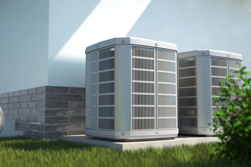 Two air heat pumps placed beside the house