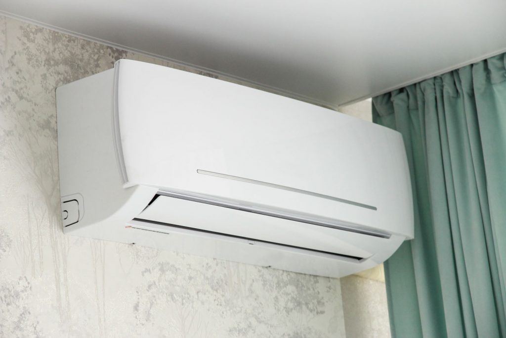 White mini split air conditioning unit installed near the ceiling