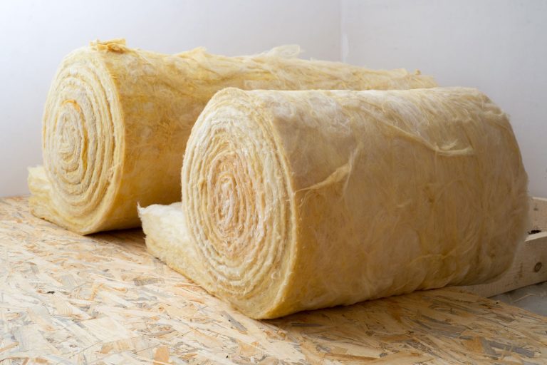 roll of mineral wool lying on the wooden floor, How Long Does Mineral Wool Insulation Last?