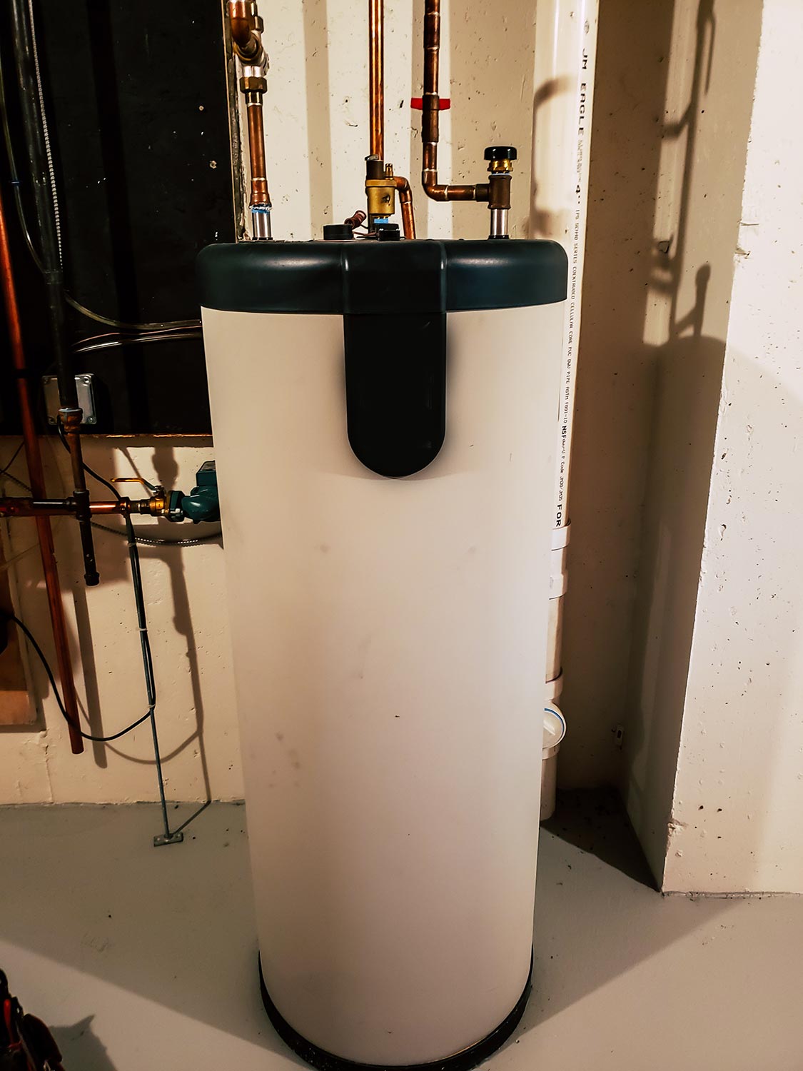 40 gallon water heater storage tank in the basement of a residential home
