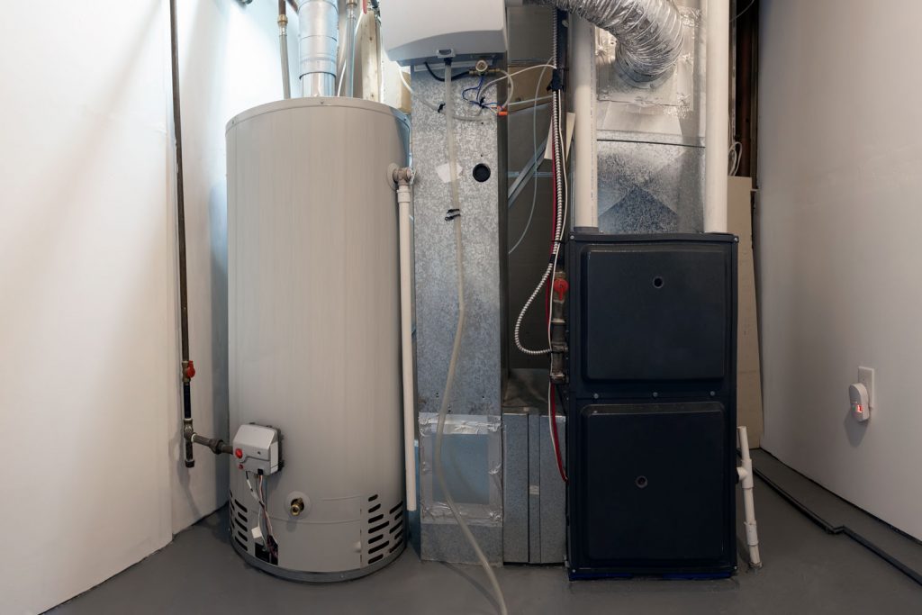 A boiler and a home furnace in the basement