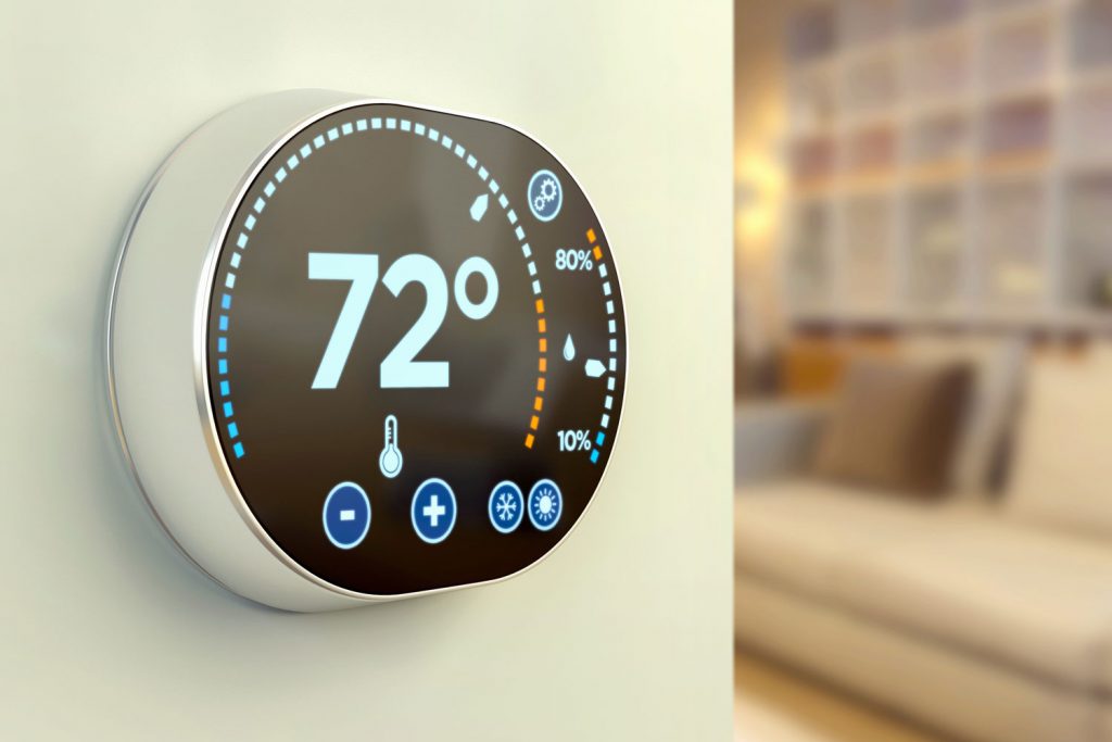 A home thermostat showing 72 degrees in room temperature