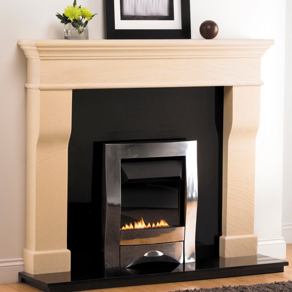 A modern limestone fireplace mantel with stainless cover