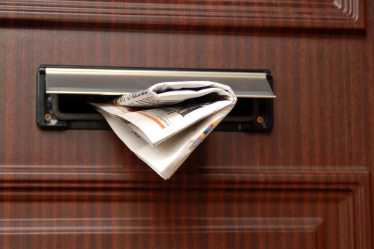 A newspaper left in the mail slot, How To Insulate A Mail Slot [5 Great Ideas]