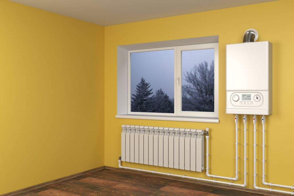 A wall mounted heater inside a bright living room