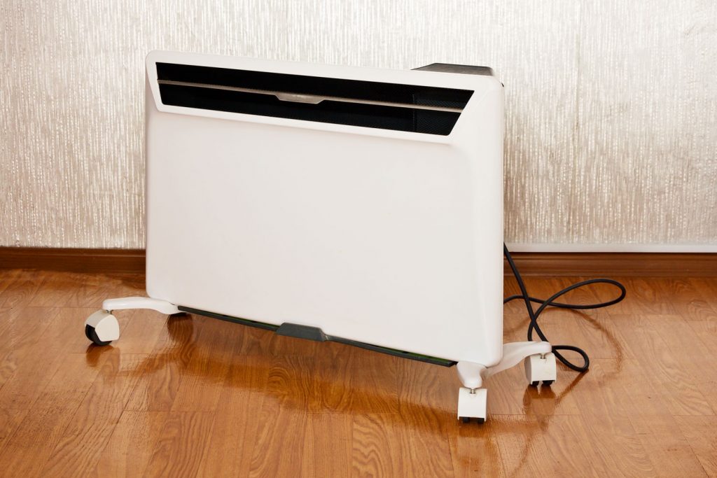 A white portable heater inside the living room
