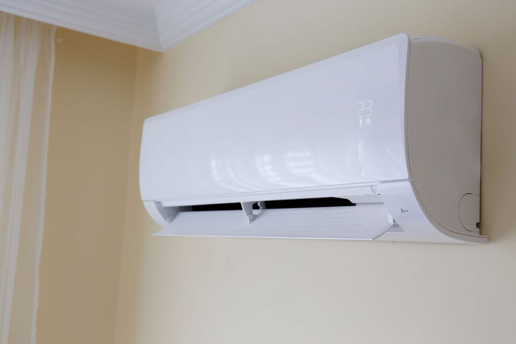Close up shot of newly installed white air conditioner.