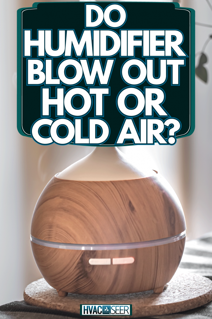 Wooden covered humidifier on the table with a gorgeous vase on the side, Do Humidifiers Blow Out Hot Or Cold Air?