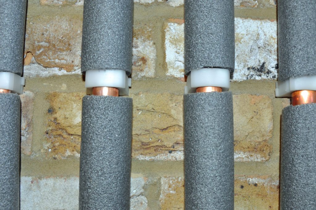 Four pipes from the boiler insulated