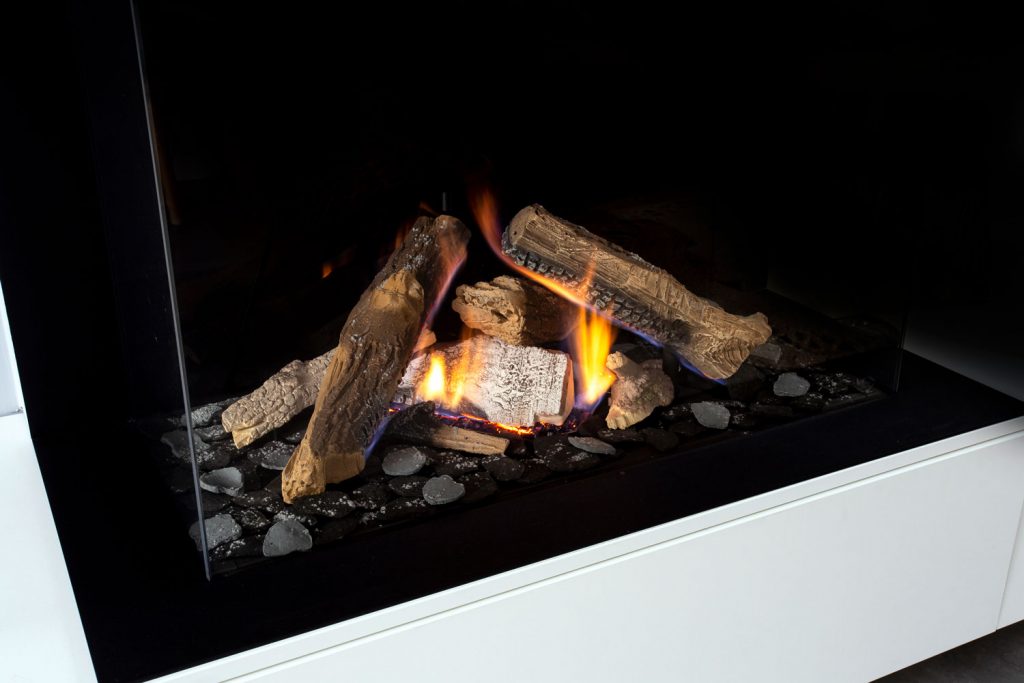 Gas fireplace with white mantel modern interior luxury design, close-up in a modern home beauty