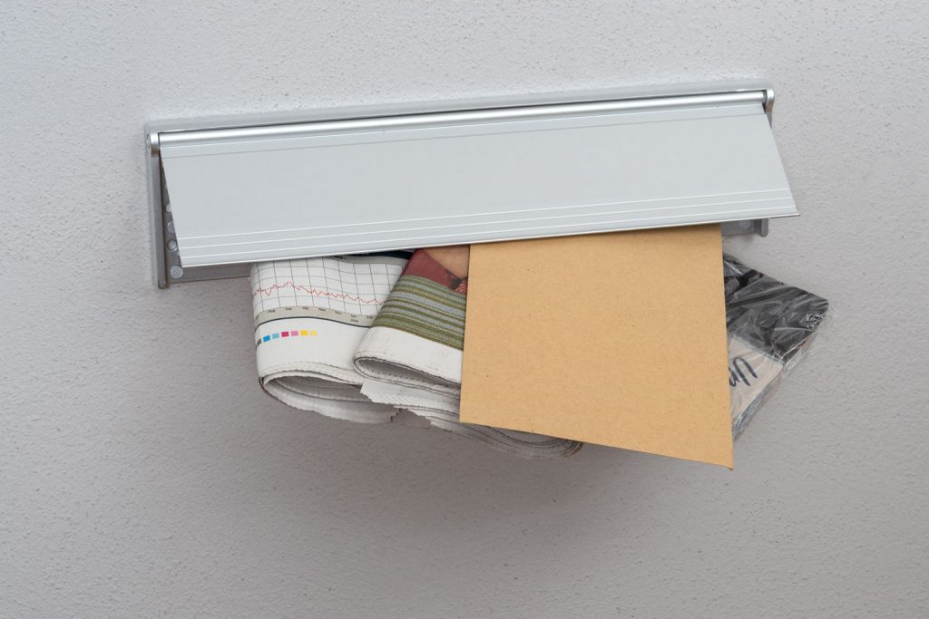 Homeowner document and other document stuck in the mail slot
