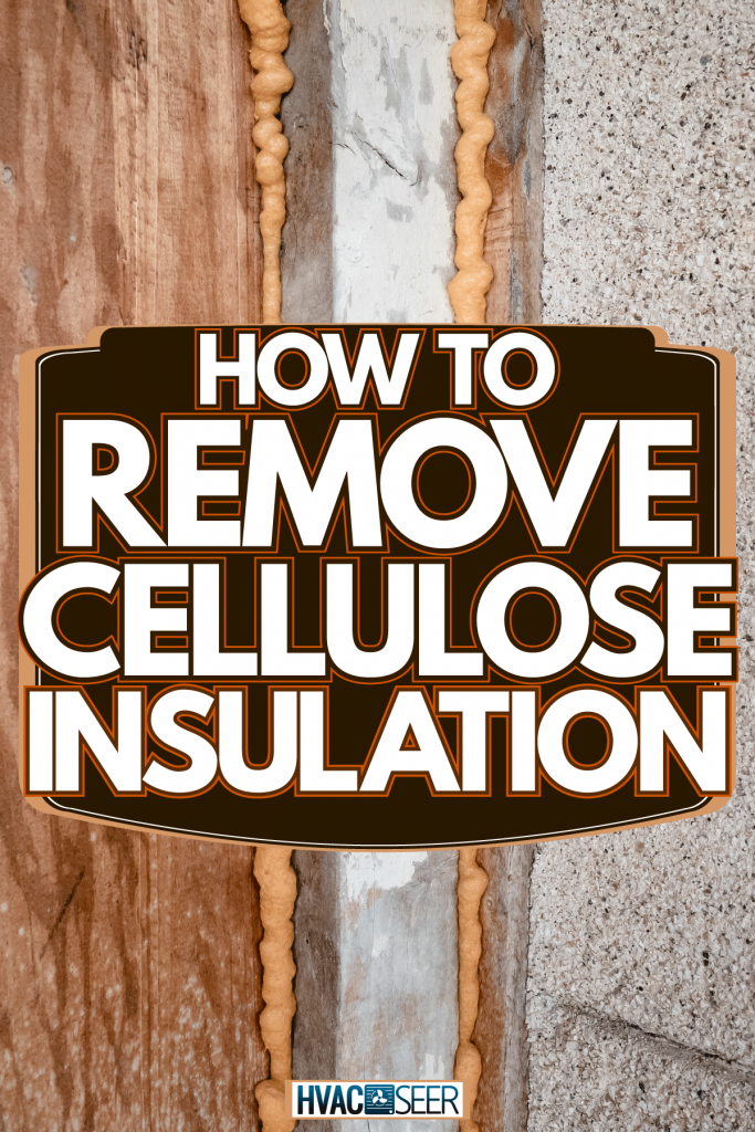 Orange insulation placed between two stone walls, How To Remove Cellulose Insulation