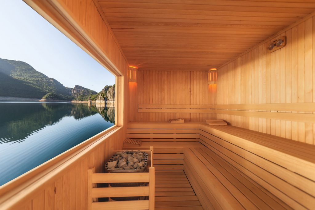 Interior of a sauna room with wooden panels from the ceiling to the floor