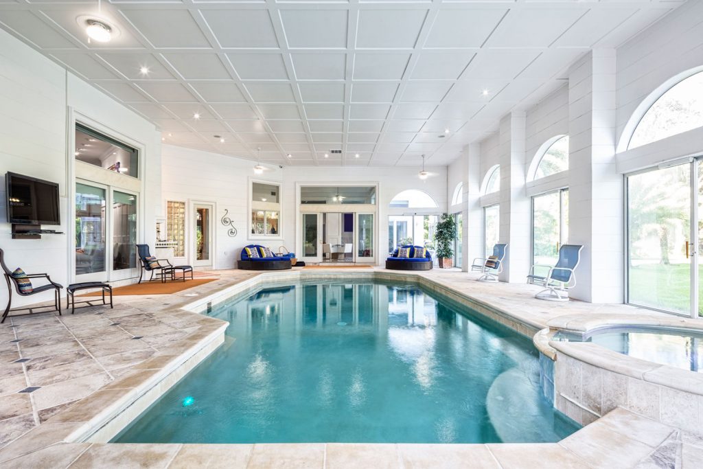 Interior of a white painted Estate house with a spa and indoor pool