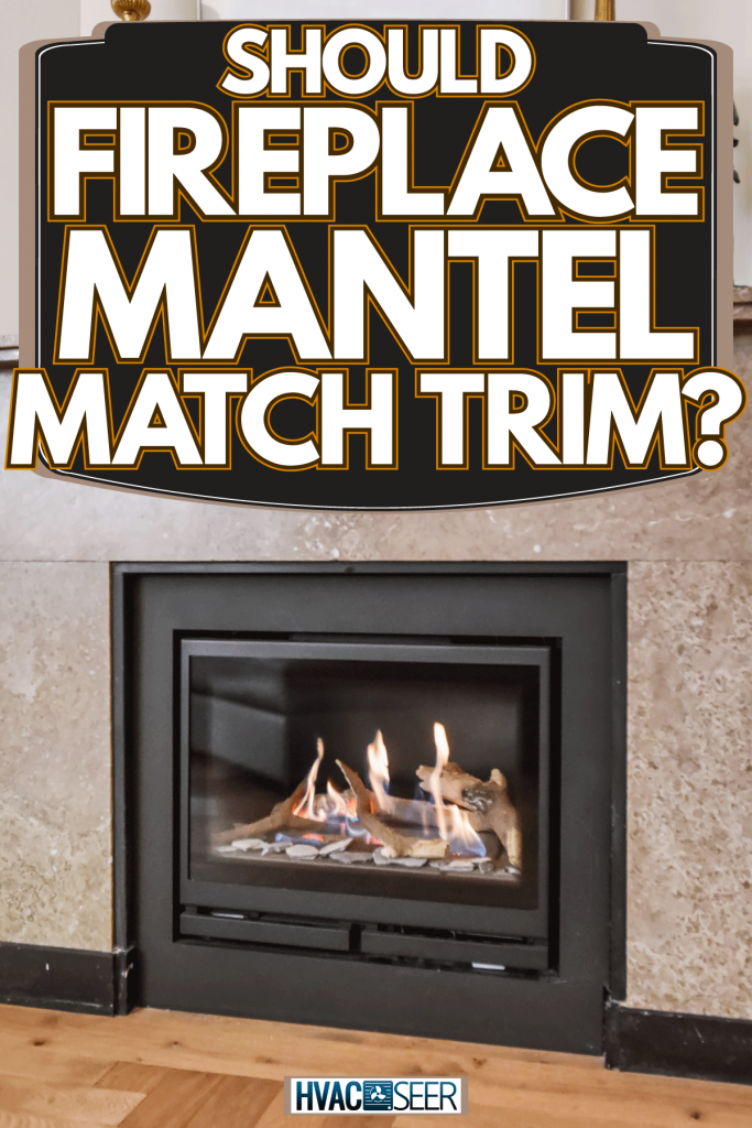 A luxurious stone covered fireplace mantel with a glass covered fireplace, Should Fireplace Mantel Match Trim?