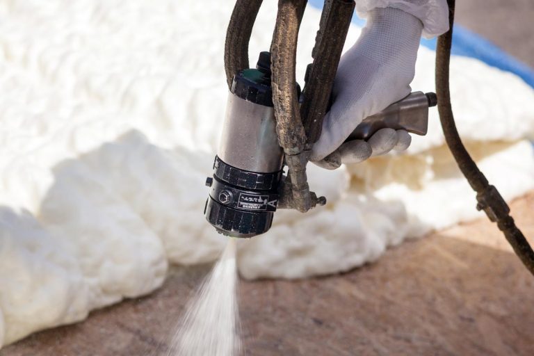 Technician spraying foam insulation using plural component spray gun, What Is The R-Value Of Spray Foam Insulation?