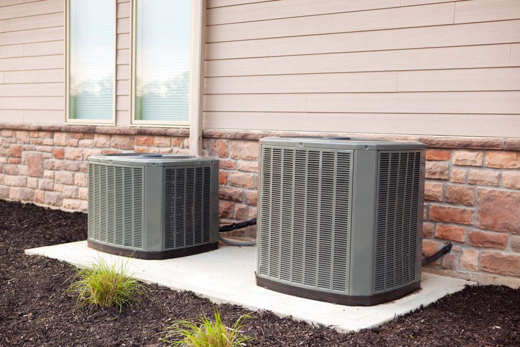 Two home air conditioning units for a residential house