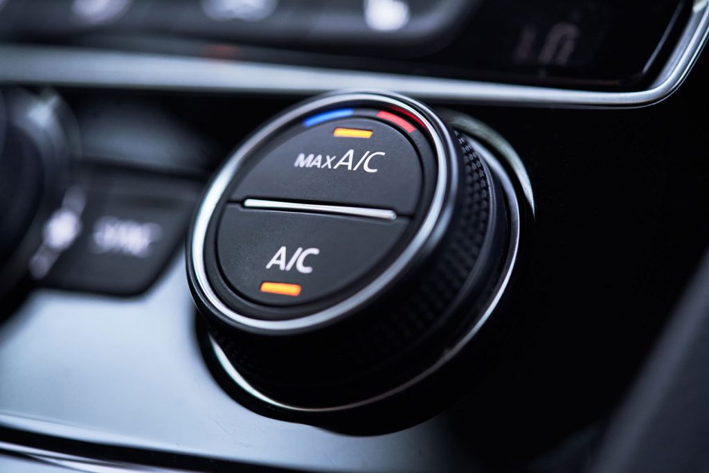 Up close photo of a car air conditioning button