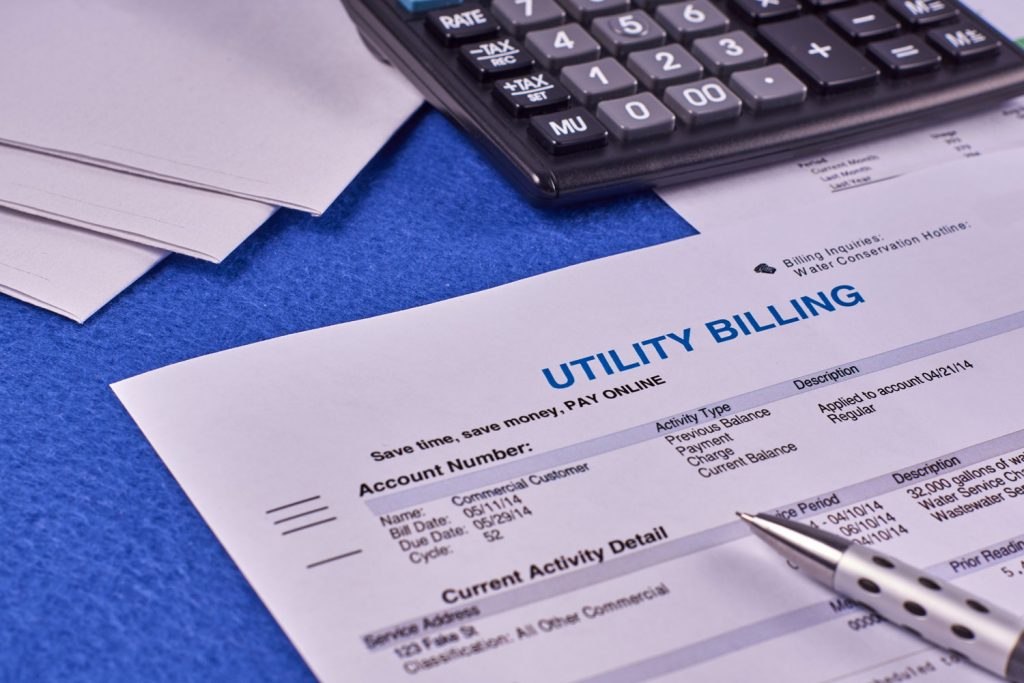 Utility bill and a calculator on the table