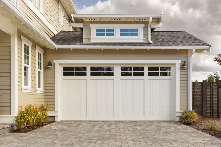 White garage door with a driveway made with brick, How To Insulate Garage Door Sides