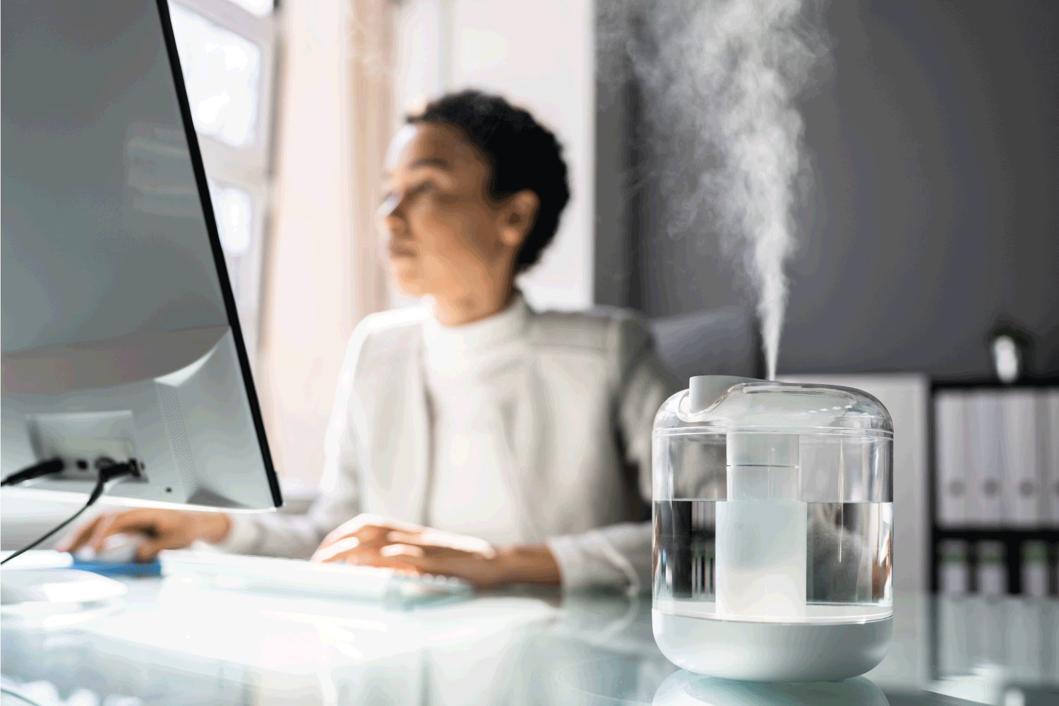 Woman In Office With Air Humidifier
