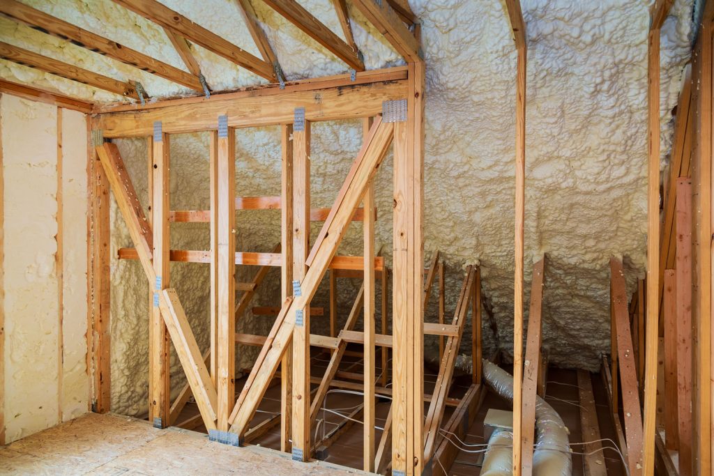 Wooden framing and foam insulation in the attic