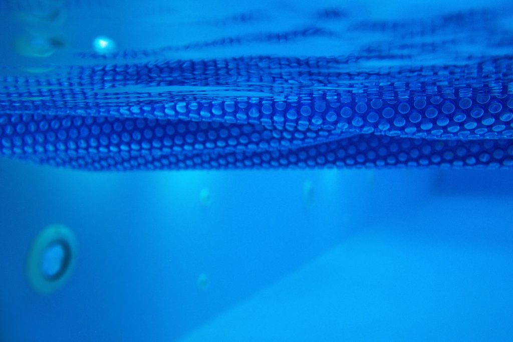 texture of the blue solar film for the swimming pool underwater