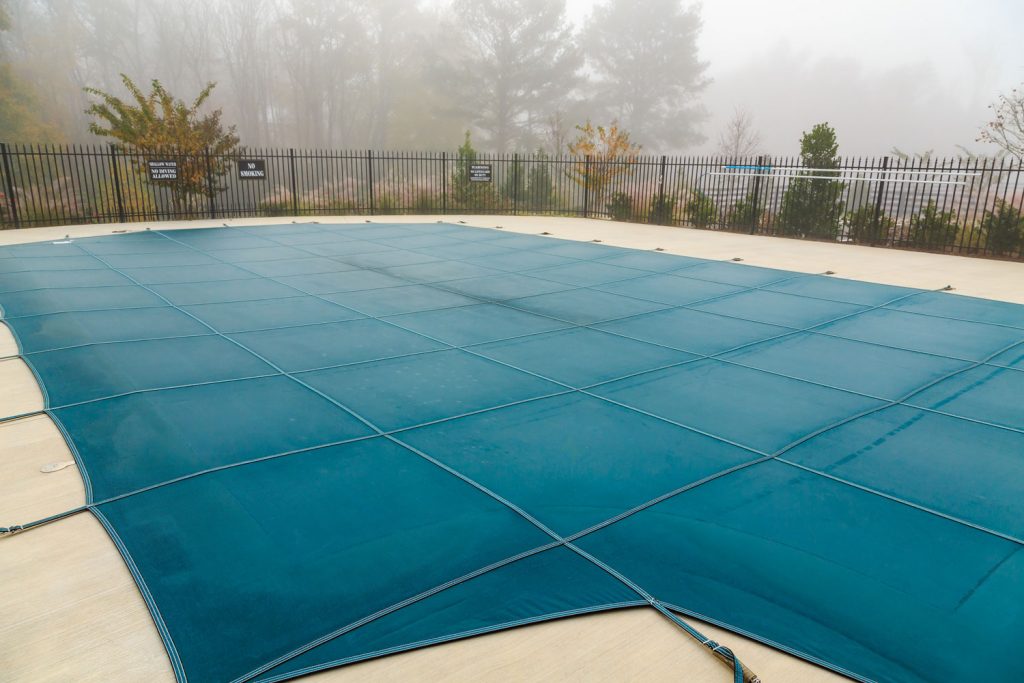 A pool covered during a foggy day