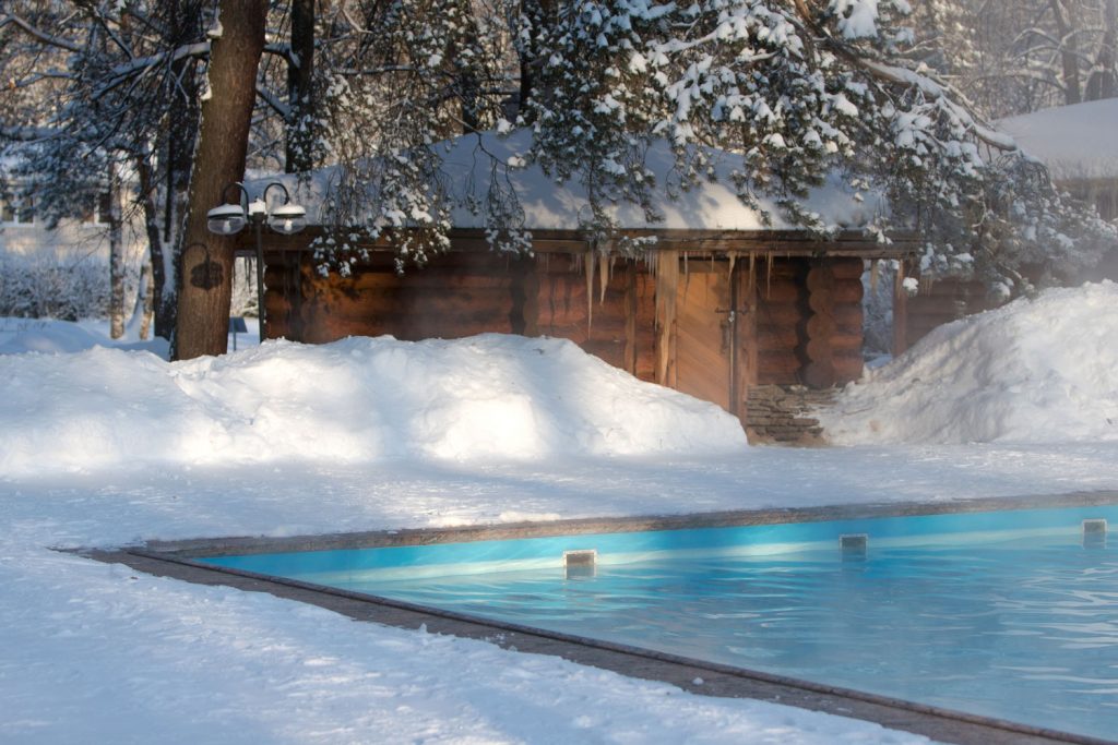 A pool steaming due to cold air at winter and the pool heater