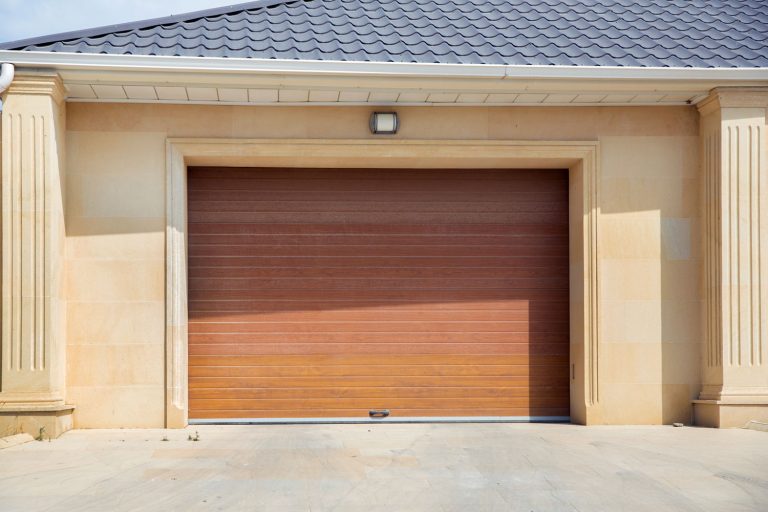 A small wooden garage door at a mansion, How To Insulate A Wooden Garage Door