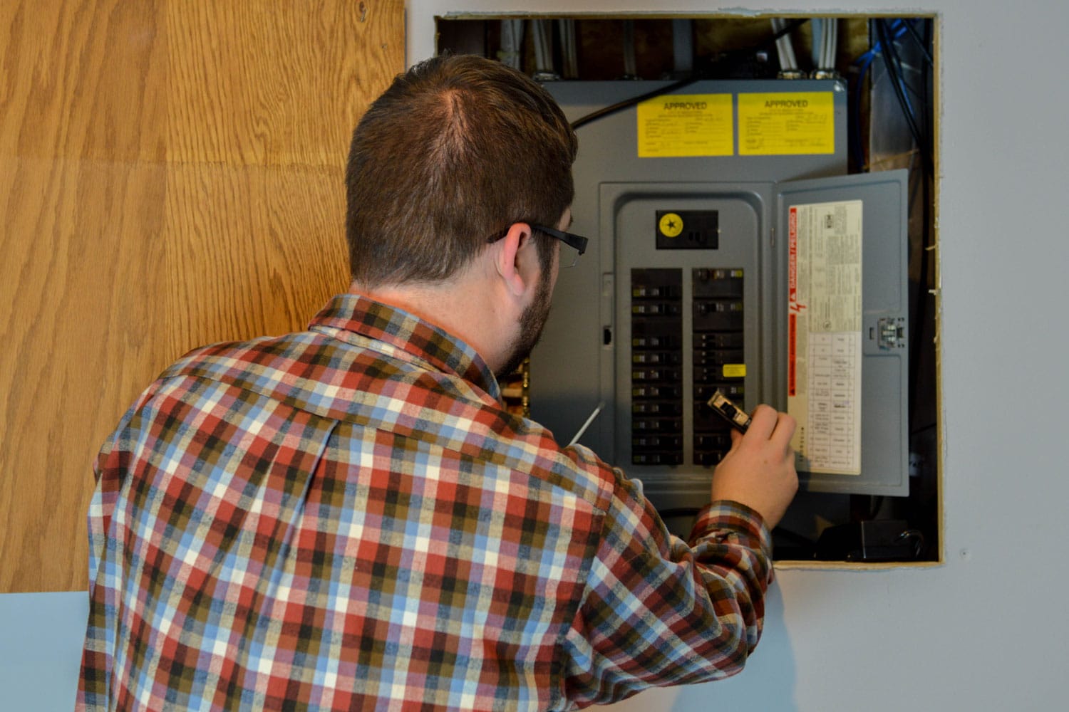 A technician checking the circuit breaker