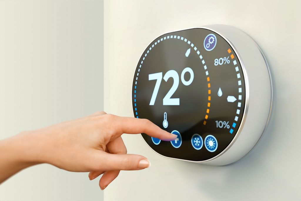 A thermostat set to 72 degrees Fahrenheit for the living room
