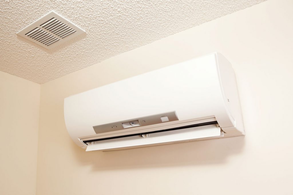 A wall-mount mini-split heating and air conditioning unit installed in a new house. 