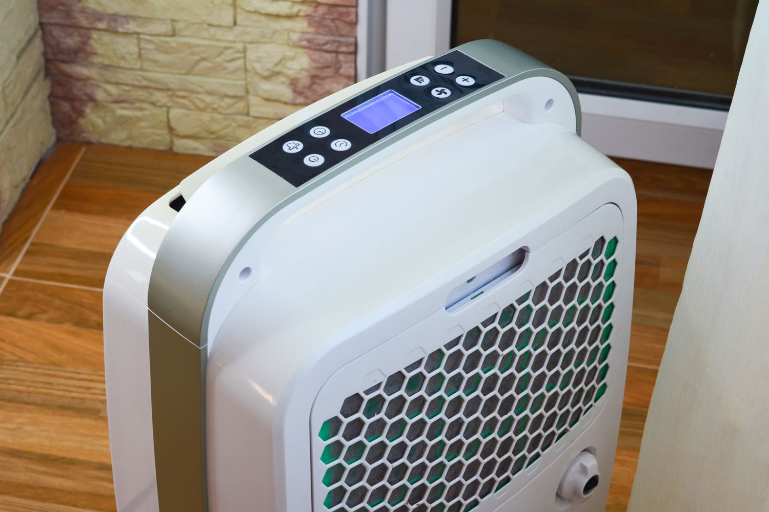 A white portable air conditioning unit at the living room