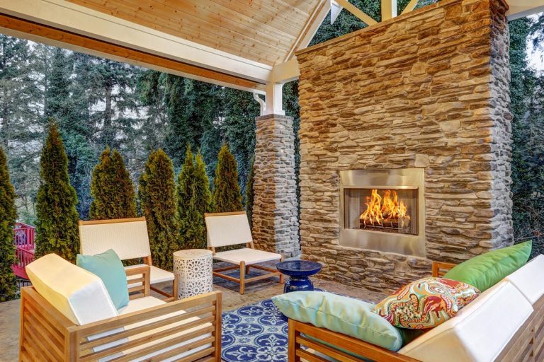 A chic covered back patio with built in gas fireplace, Should A Gas Fireplace Be Turned Off in Summer?