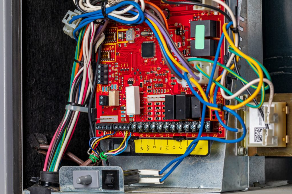 Closeup of heater circuit control board inside of furnace.