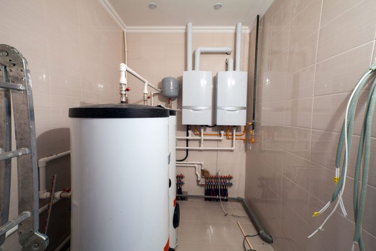 Copper valves, stainless ball valves, detectors of water pressure and plastic pipes of central heating system and water pipes with thermal insulation in the boiler room, What Are The Dimensions Of A 50-Gallon Water Heater?