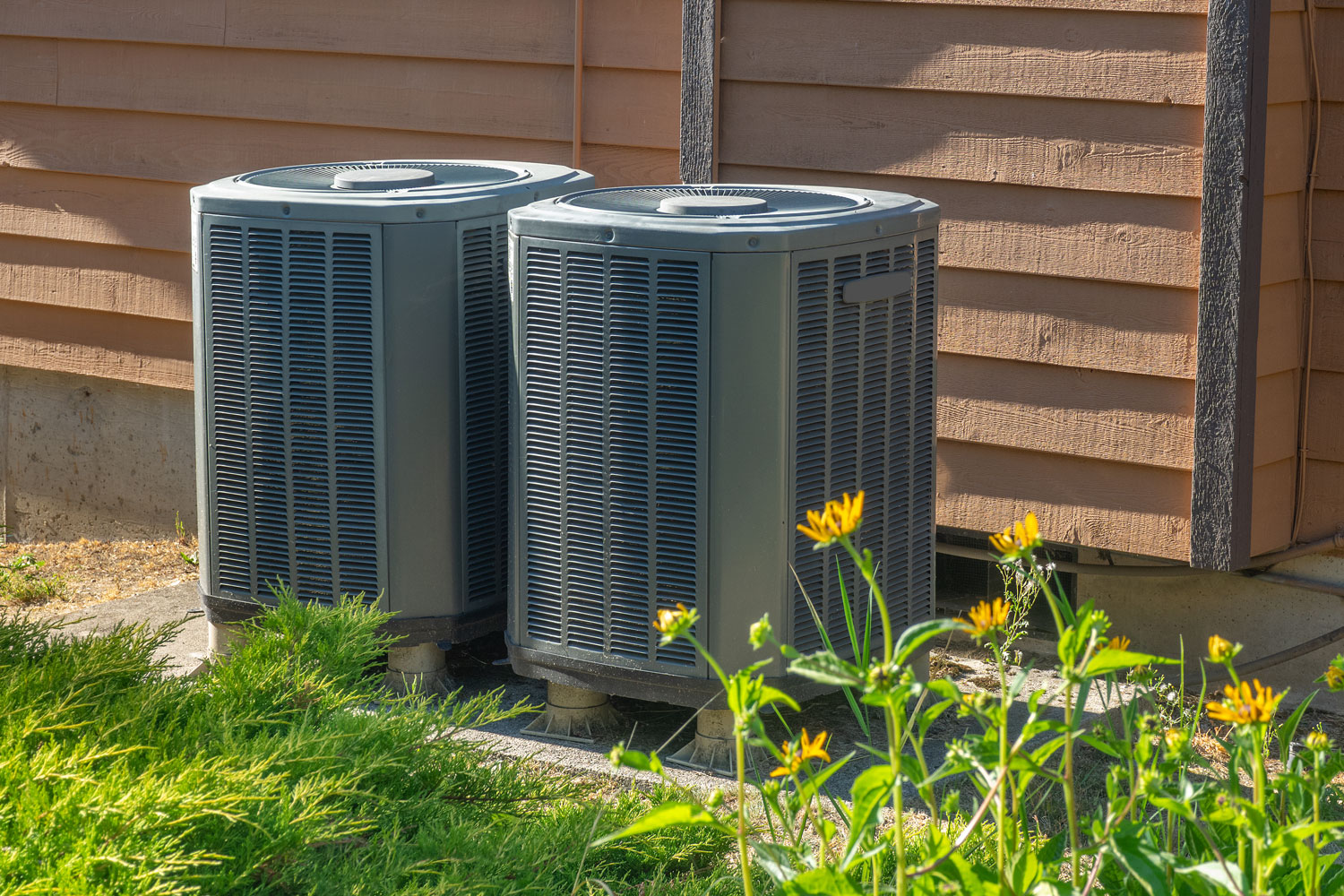 Gray Lennox air conditioning units outside the house