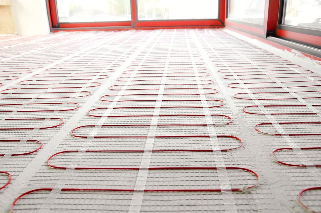 Heating red electrical cable on cement floor 
