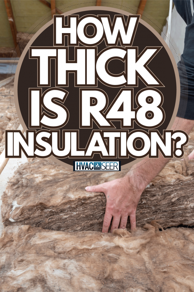 Worker placing a block insulation of the attic, How Thick Is R48 Insulation?