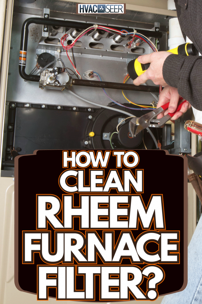 Technician checking the furnace in the basement, How To Clean Rheem Furnace Filter