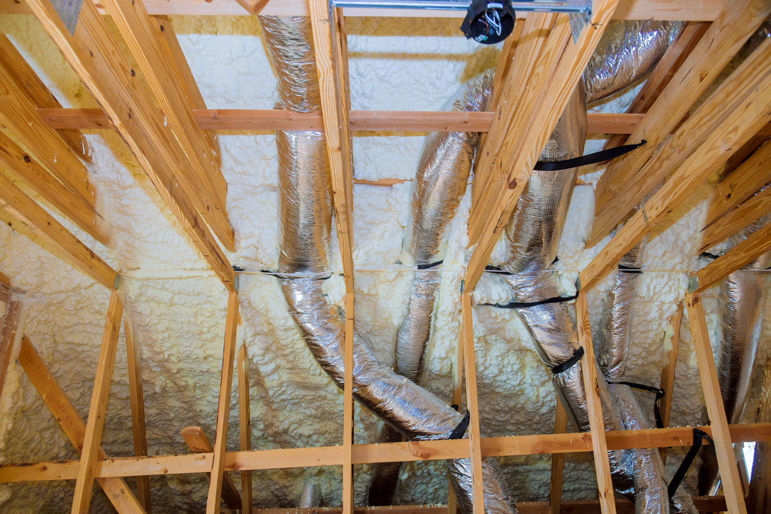 Insulation foam on the attic ceiling and ducting's for ventilation