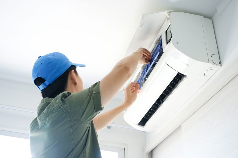 Male install air conditioner at room, Can You Install A Ductless Air Conditioner On An Inside Wall?