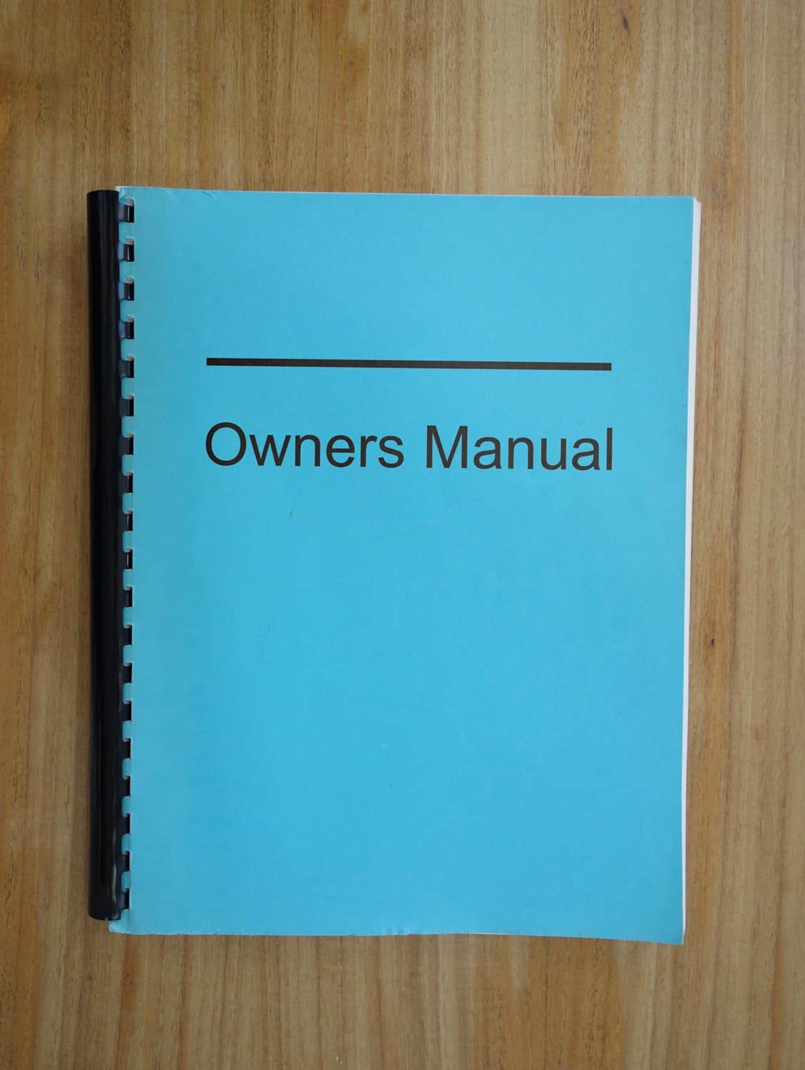 Owners manual binder on a desk