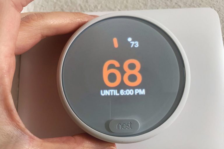 A white nest thermostat used to save energy and cut costs on your electric bill, How Big Is A Nest Thermostat?