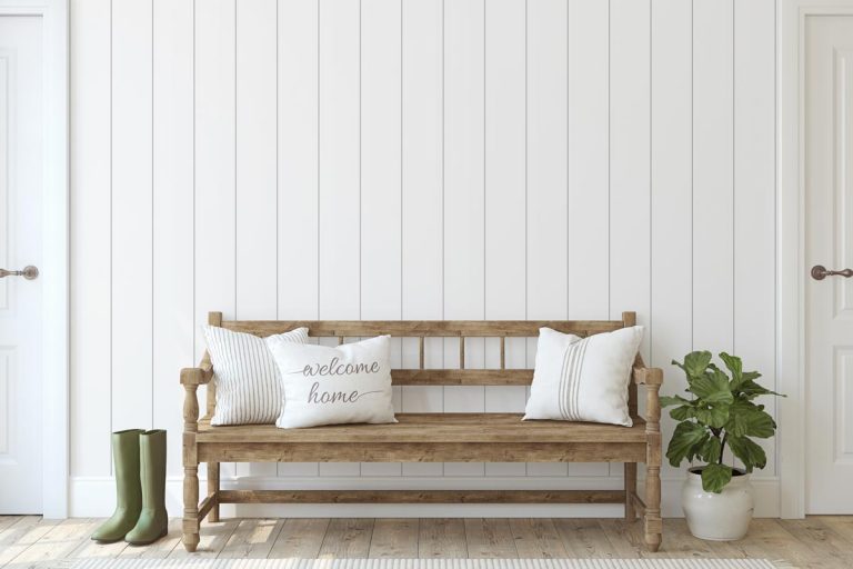 Wooden bench near white shiplap wall, How To Insulate Behind Shiplap?