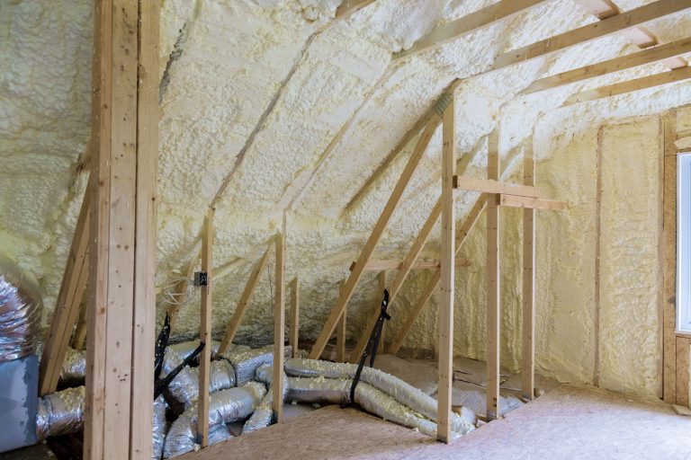 Attic room showing insulation on all the walls, Does Batt Insulation Help With Sound?