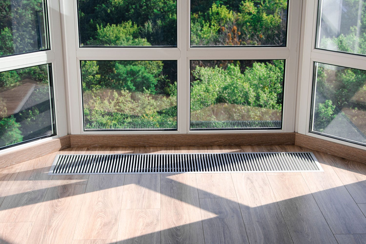 A panoramic bay view window with a protective grill for the vent